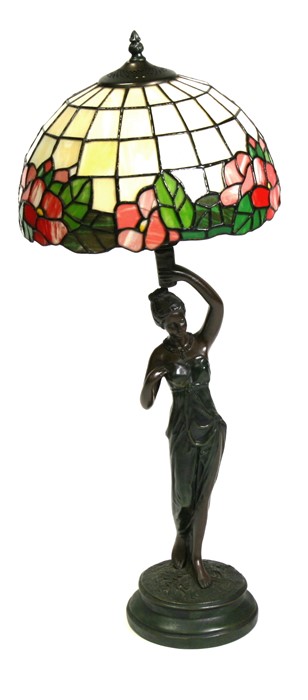 A figural bronzed table lamp with Tiffany style shade, 75cms (29.5ins) high.