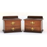 A pair of mahogany dressing table chests, each with two short drawers, 28cms (11ins) wide.