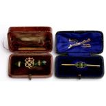 A 9ct gold bar brooch set with three jade cabochons in original box; together with another