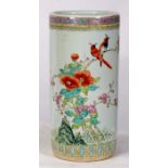 A Chinese famille rose cylindrical stick stand decorated with flowers and birds, 45cms (17.75ins)