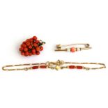 A 14ct gold & coral bracelet; together with a gold & pearl bar brooch; and a coral pendant.