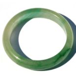 A Chinese jadeite bangle, weight 47g, 7.5cms (3ins) diameter.