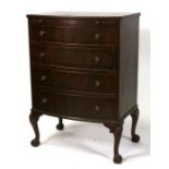 A mahogany bow fronted chest, the brushing slide above four long graduated drawers, on cabriole legs