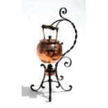 An Arts & Crafts copper & wrought iron spirit kettle on stand, 53cms (21ins) high.