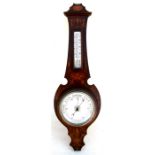 An Edwardian inlaid mahogany wall mounted aneroid barometer thermometer. 77cm (30.25 ins) high