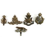 Small collection of cap badges including West Riding Royal Horse Artillery, Queens Own