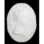 An alabaster oval plaque depicting a young gentleman, possibly Byron, 32 by 42cms (12.5 by 16.