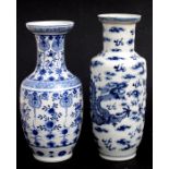 A Chinese blue & white rouleau vase decorated with dragons chasing a flaming pearl amongst clouds,