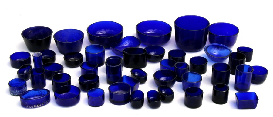 A quantity of blue glass liners, mainly salts.