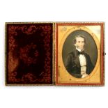 A hand coloured photograph of a gentleman by Gurney & Frederick's, 349 Broadway, in an ornate