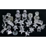 A quantity of Swarovski crystal items including candle holders, animals and similar glassware.