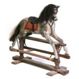 A late 19th / early 20th century carved and painted wooden rocking horse with horse hair mane &