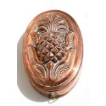 A Victorian tin lined copper jelly mould, numbered '175', 15cms (6ins) long.