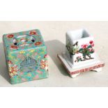 A Chinese square form famille rose incense burner decorated with flowers on a green ground with