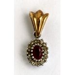 A 9ct gold ruby and diamond pendant