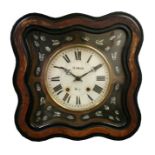 A continental wall clock, the white glass dial with Roman numerals, in an ebonised case with