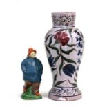 A Persian influence baluster vase, 23cms (9ins) high; together with a pottery figure of a