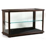 A late 19th / early 20th century glazed mahogany shop counter display cabinet with single glass