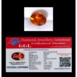 A natural sapphire loose gemstone with GGL certificate report stating the sapphire to be 9.65cts,