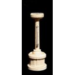 A 19th century geometric turned ivory thermometer tower with compass inset to the top and box to the