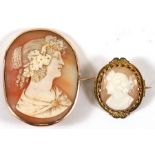 A late 19th century cameo brooch in a yellow metal mount, 4.5cms (1.75ins) high; together with a