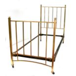 An Edwardian brass single bed.