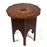 An Islamic marquetry specimen wood inlaid table, 54cms (21.25ins) diameter.