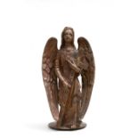 A continental bronze alter figure in the form of an angel holding a cross, with traces of gilding,