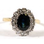 An 18ct gold diamond & sapphire cluster ring, approx UK size 'R'.