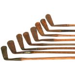 A quantity of hickory shafted gold clubs.