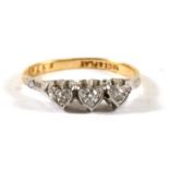 An 18ct gold three-stone diamond ring, approx UK size 'L'.