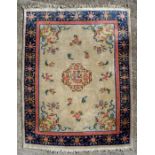 A Chinese woollen carpet with central medallion and pink flower border, 239 by 173cms (94 by