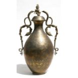A large Indian brass two-handled vase and cover highly engraved with figures and foliate scrolls,