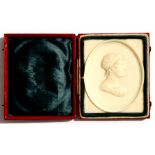 A 19th century Grand Tour carved ivory cameo portrait of a young lady, cased, 5.5 by 7cms (2.2 by