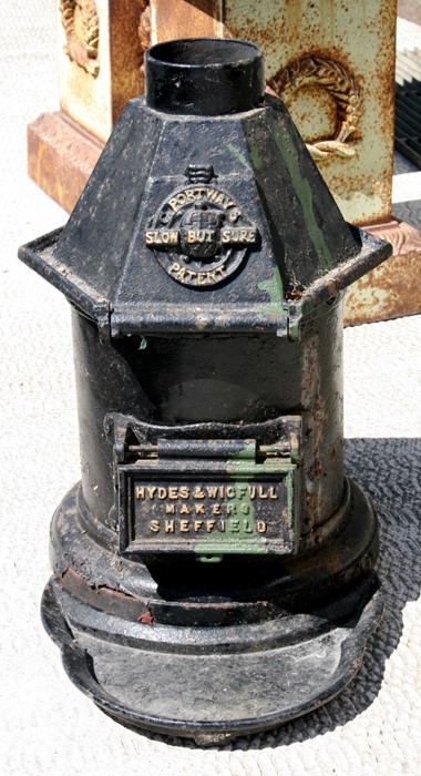 A 19th century cast iron stove - C Portways Patent Slow But Sure, 55cm (21.5ins) high.Condition