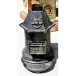 A 19th century cast iron stove - C Portways Patent Slow But Sure, 55cm (21.5ins) high.Condition