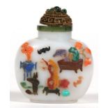 A Chinese jade snuff bottle with coral and hardstone inlay depicting precious objects, flowers and a