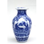 A Chinese blue & white vase decorated with figures seated at a table, 32cms (12.5ins) high.