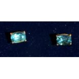 A pair of 9ct gold rectangular cut green apatite stud earrings.