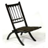 A late 19th century Aesthetic Movement ebonised folding chair.