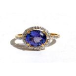 An 18ct gold tanzanite and diamond ring, approx UK size N.