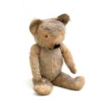 A Merrythought plush jointed teddy bear, 44cms (17.25ins) high.Condition Report Eyes missing and