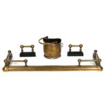 A brass fire curb; together with a brass coal scuttle and a pair of fire dogs (4).
