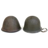 A WWII American helmet with scratched name to Sgt. Dumont; together with a Russian helmet (2).