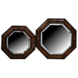 Two octagonal oak framed bevelled wall mirrors, the largest 53cms (21ins) diameter (2).