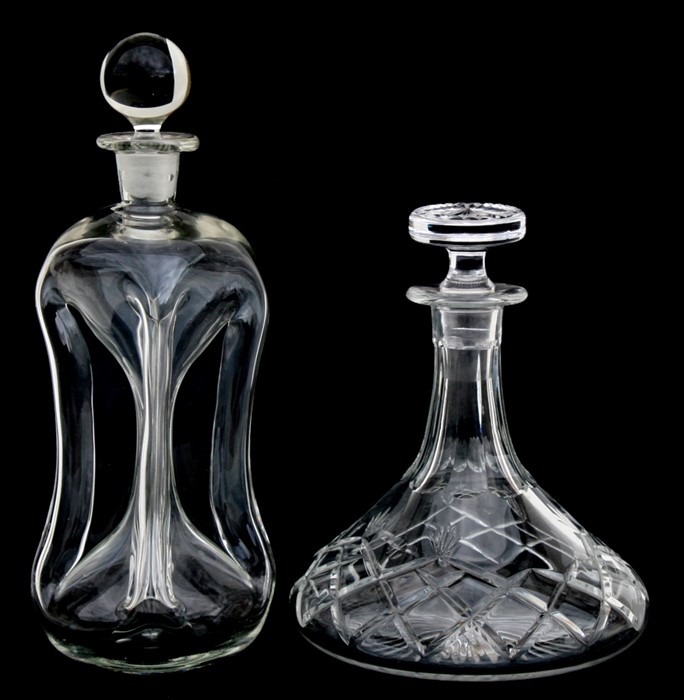 An early 20th century clear glass decanter with waisted body; together with a cut glass ship's