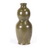 A Chinese green tea dust glaze vase, 34cms (13.5ins) high.