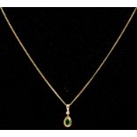 A 9ct gold emerald & diamond pendant, on a 9ct gold chain.