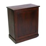 A Victorian mahogany cupboard with single door, on plinth base, 65cms (25.5ins) wide.