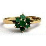 A green stone cluster dress ring, approx UK size 'N'.